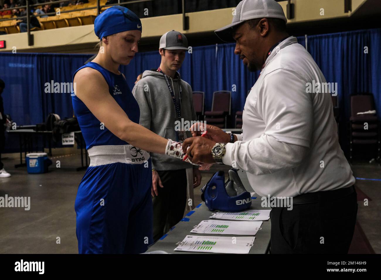 https://c8.alamy.com/comp/2M146H9/lubbock-tx-usa-9th-dec-2022-christine-forkins-of-nashville-tn-has-her-hand-wraps-inspected-by-a-usa-boxing-official-prior-to-getting-her-gloves-before-her-semifinal-bout-credit-image-adam-delgiudicezuma-press-wire-credit-zuma-press-incalamy-live-news-2M146H9.jpg