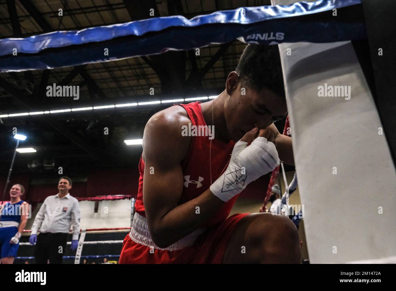 Lubbock, TX, USA. 9th Dec, 2022. Stacia Suttles of Philadelphia, PA kneels for a moment of prayer following her of her Elite Female 146lb contest in which she was declared the winner. (Credit Image: © Adam DelGiudice/ZUMA Press Wire) Credit: ZUMA Press, Inc./Alamy Live News Stock Photo