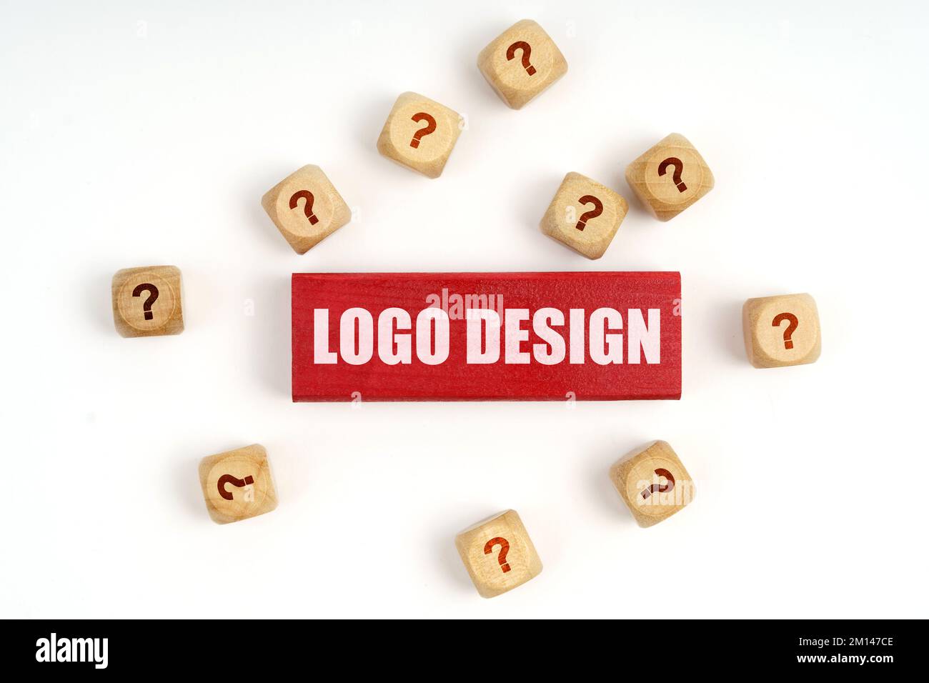 Question concept. On the table are cubes with questions and a red plaque with the inscription - Logo Design Stock Photo