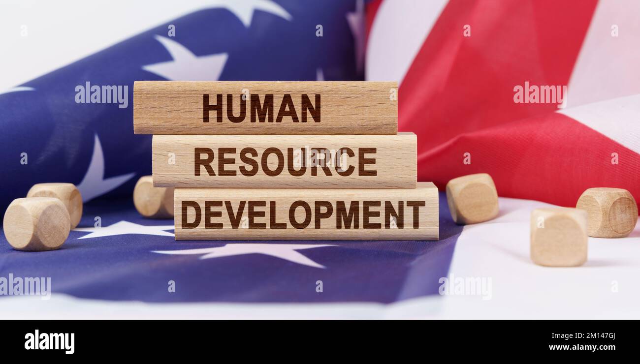 Business concept. The American flag has wooden cubes and plaques that ...