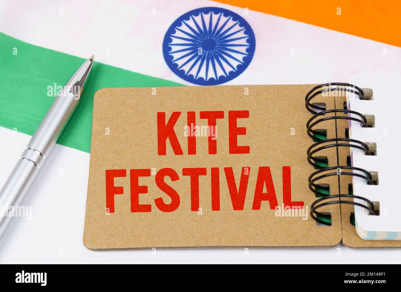 Holidays in India. Against the background of the flag of India lies cardboard with the inscription - Kite festiva Stock Photo