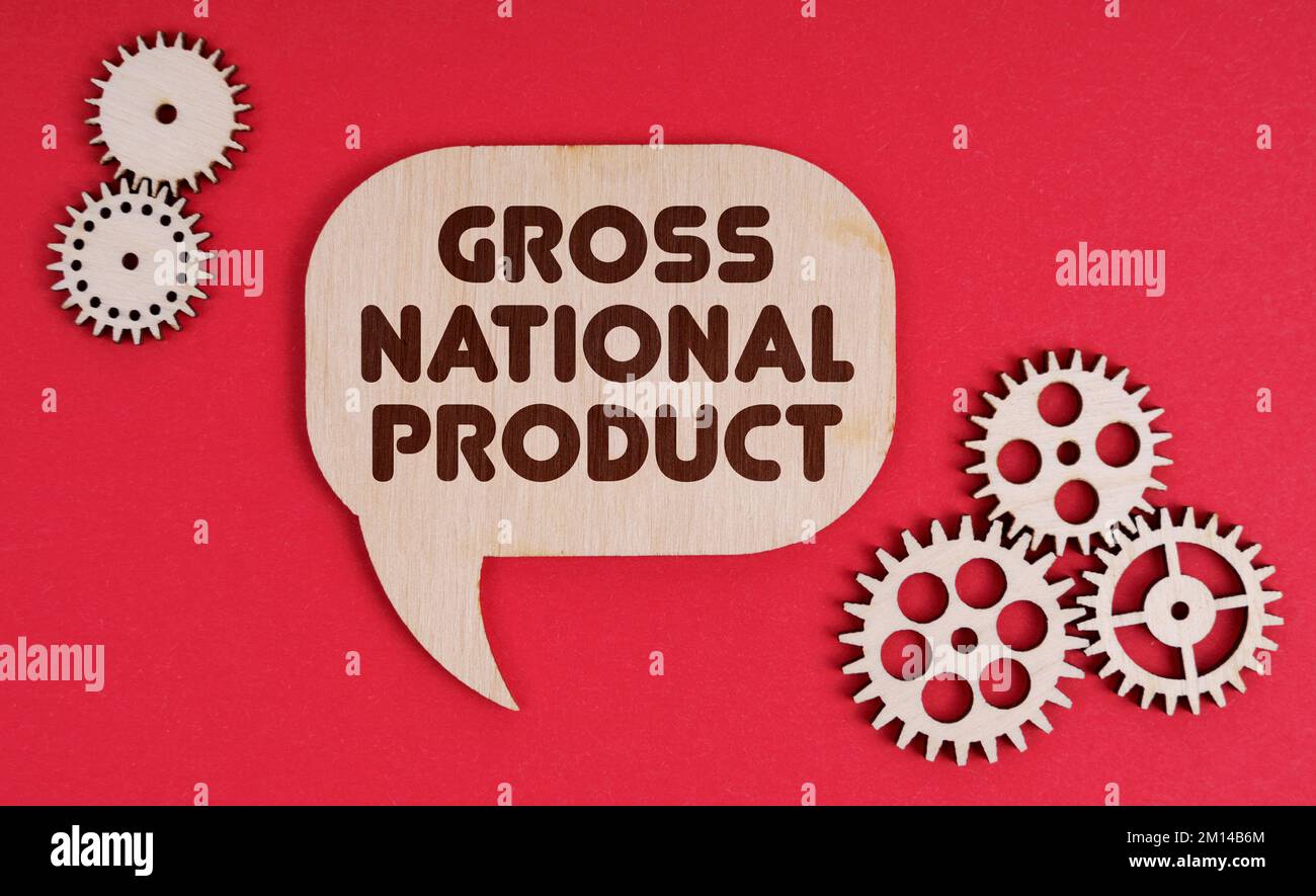 Business and finance concept. On a red background, gears and a thought plate with the inscription - Gross National Product Stock Photo