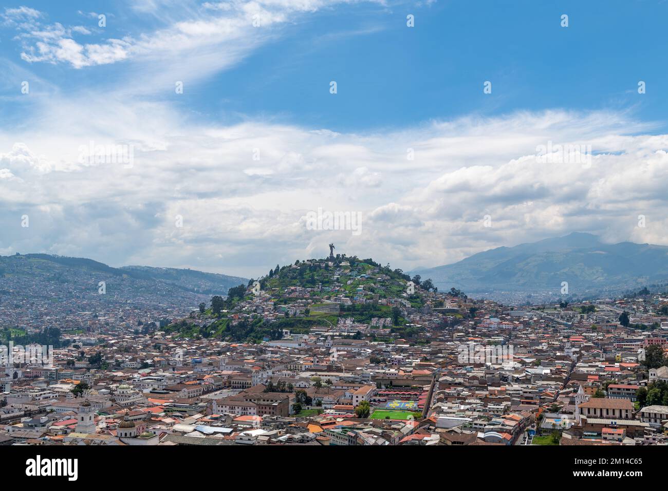 Aerial cityscape of Quito historic city center with Panecillo Hill and Virgin of Quito statue, Pichincha, Ecuador. Stock Photo