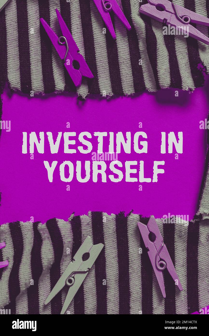Hand writing sign investing in yourself business concept learning new