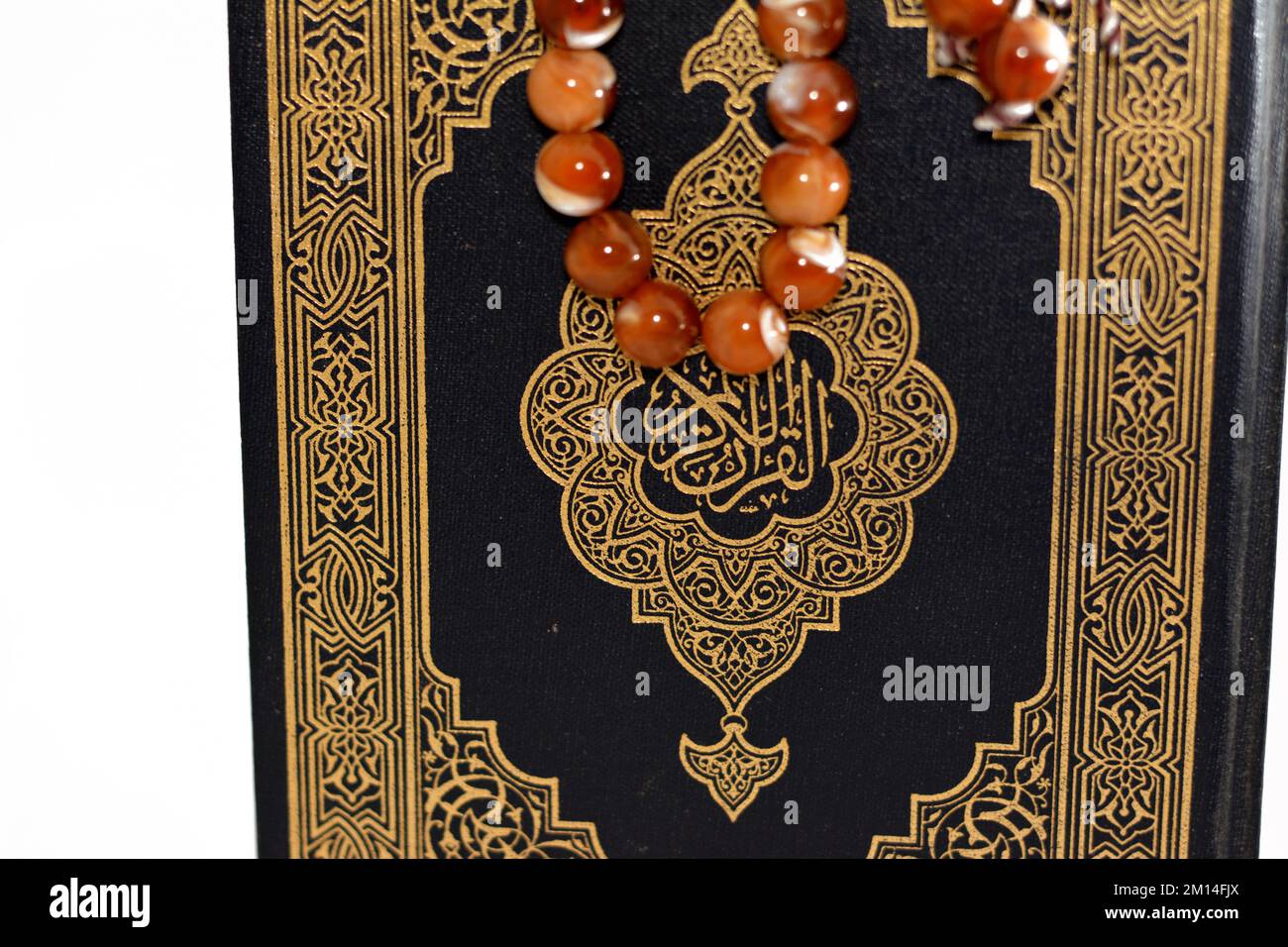 The holy Quran, Qur'an or Koran (the recitation) is the central religious text of Islam, believed by Muslims to be a revelation from God (Allah), isol Stock Photo