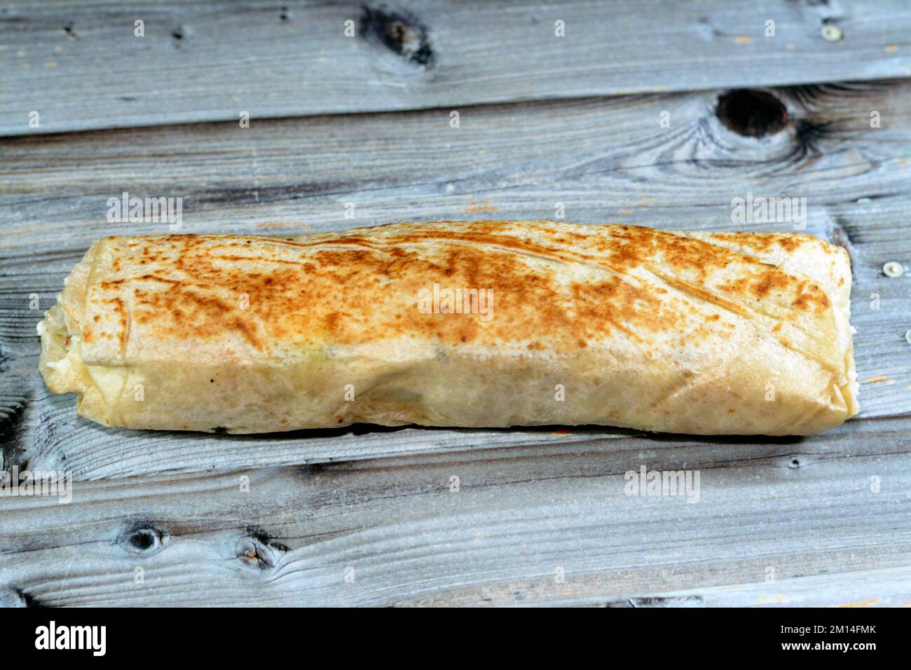 Syrian recipe cuisine background, chicken shawerma or shawarma tortilla