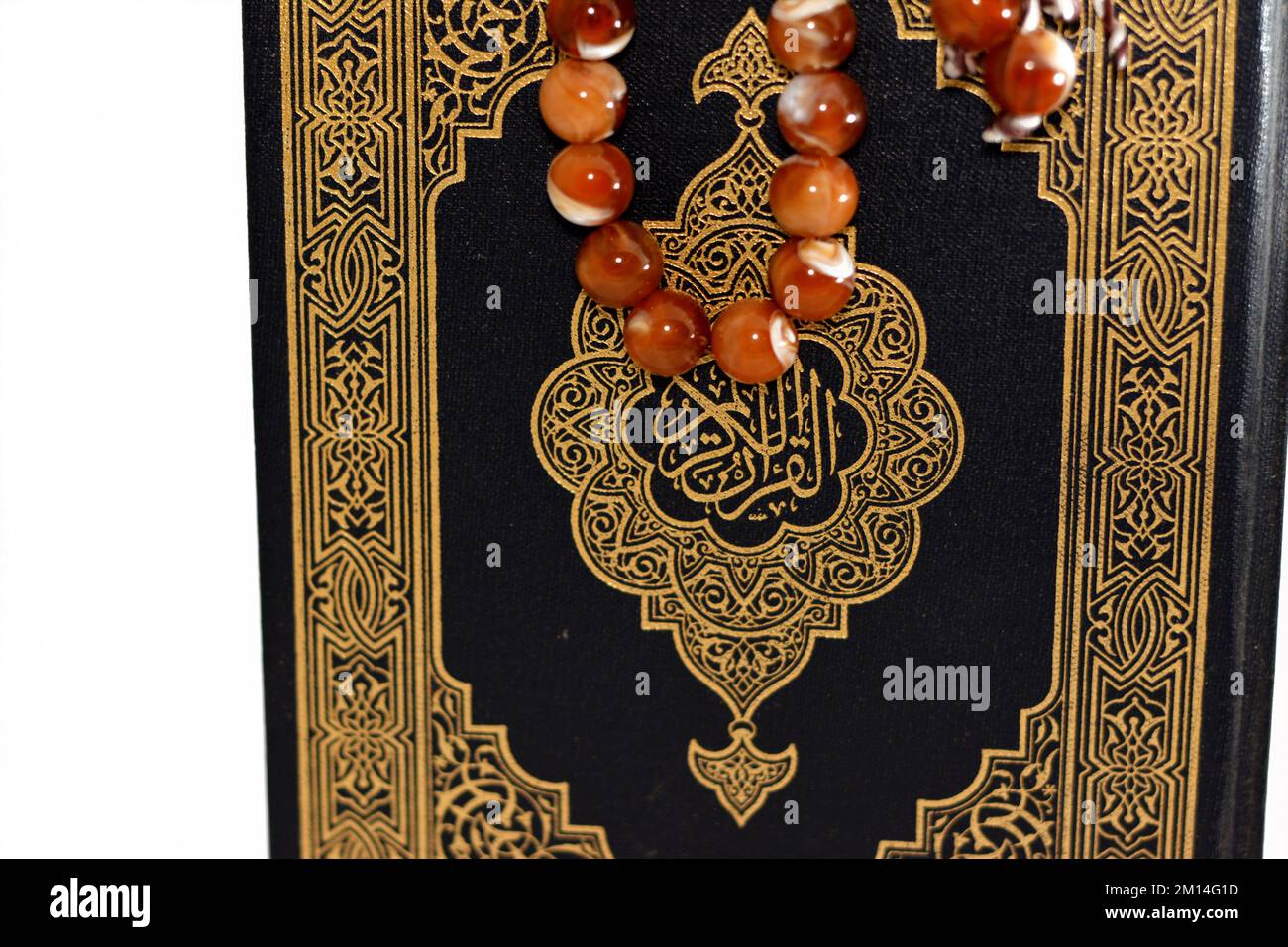 The holy Quran, Qur'an or Koran (the recitation) is the central religious text of Islam, believed by Muslims to be a revelation from God (Allah), isol Stock Photo