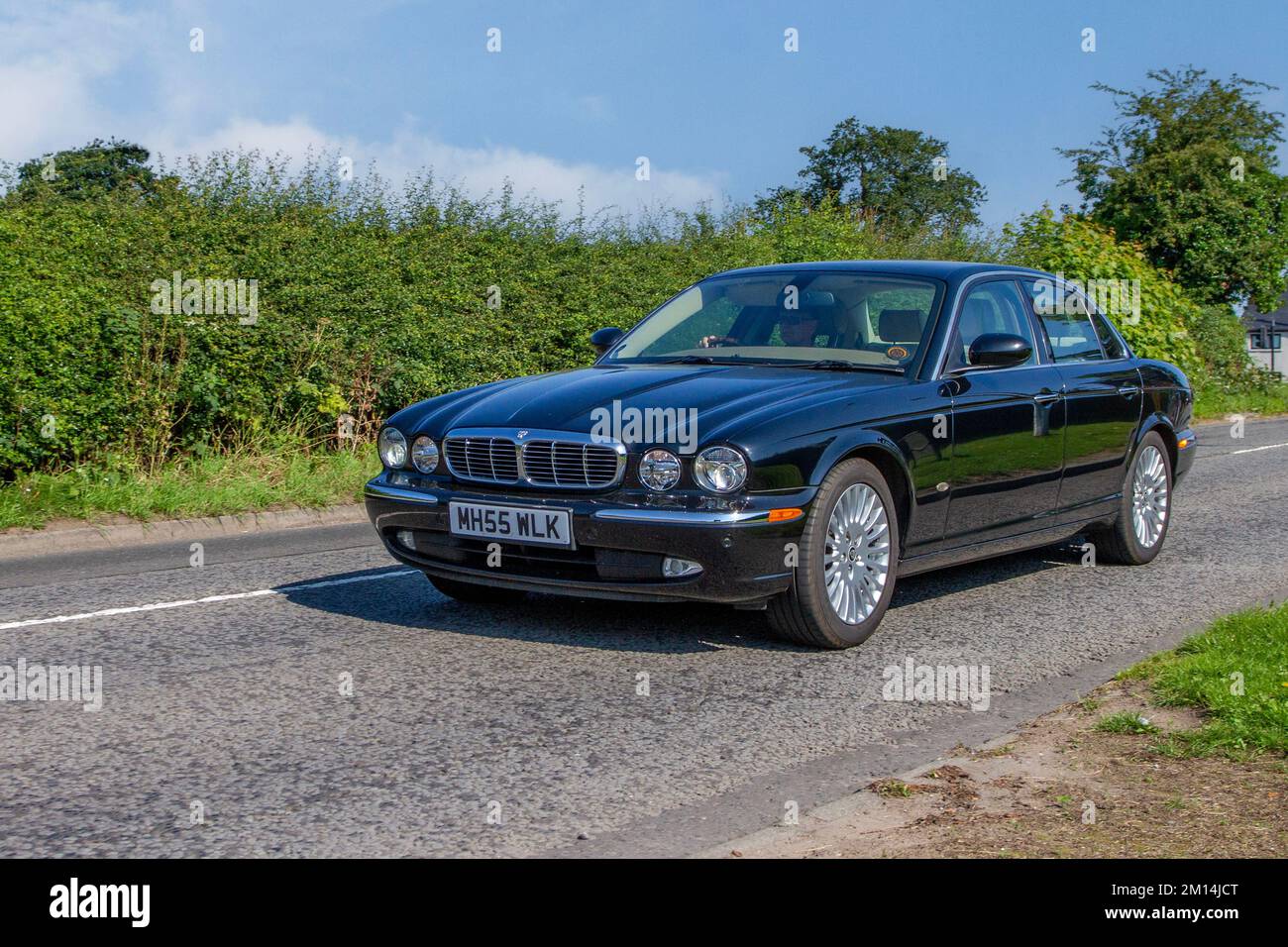 2006 Black Jaguar XJ6 V6 Sovereign Auto; en-route to Capesthorne Hall classic May car show, Cheshire, UK Stock Photo