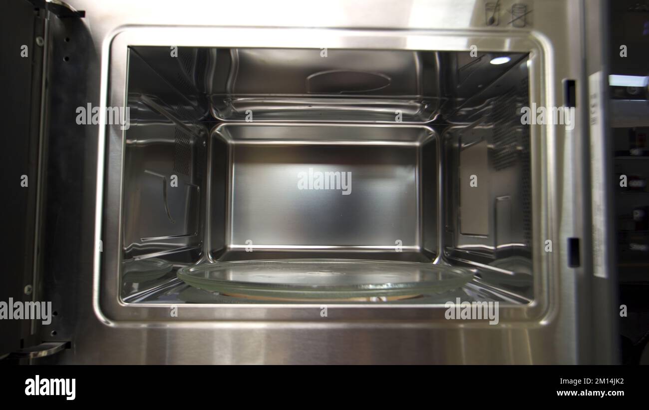 View inside of microwave oven, concept of cooking and technologies