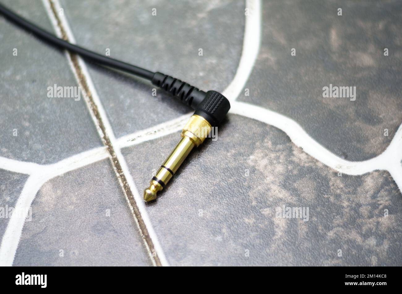 Close-up Shot Of 3.5mm Audio Jack Cable With 6.35mm Converter Attached Stock Photo