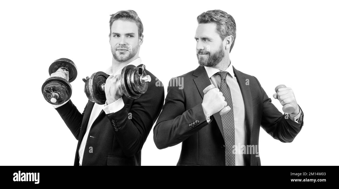 Cooperation not competition. Businessmen do dumbbell workout. Competition is the life of business Stock Photo