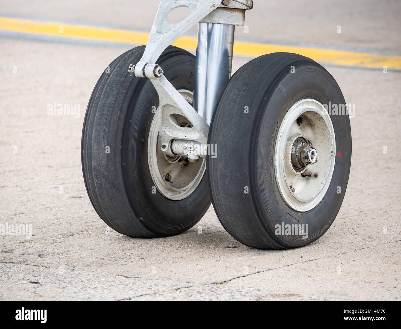 Close up detail with a landing gear of a airplane. Aircraft tires