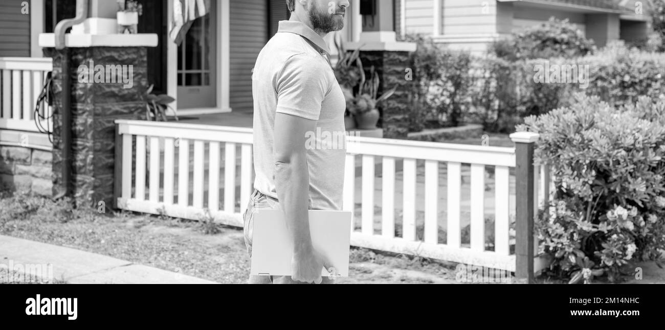 real estate agent at house for sale. realtor holding laptop. rent or