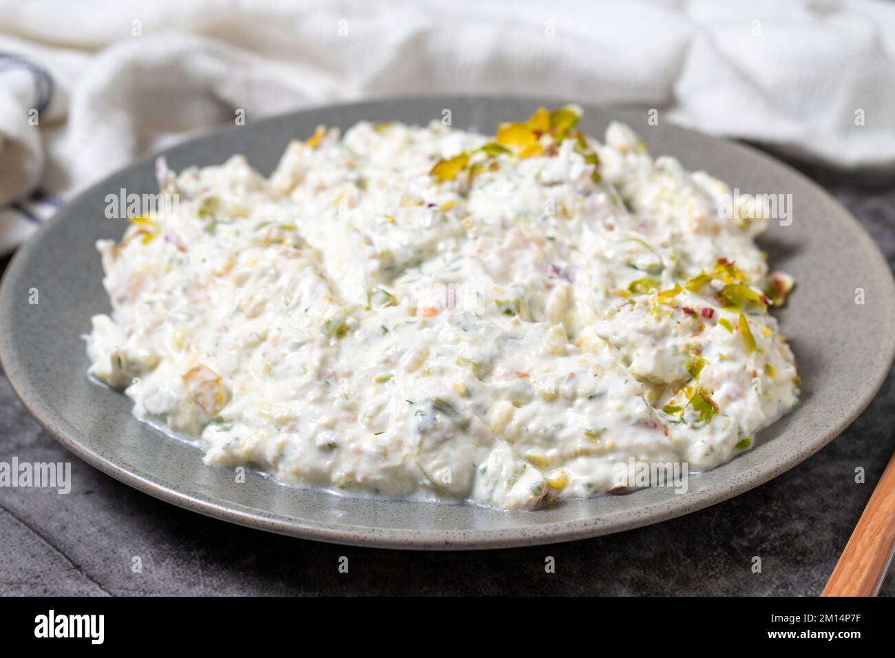 Roasted eggplant salad with yogurt on a dark background. Turkish