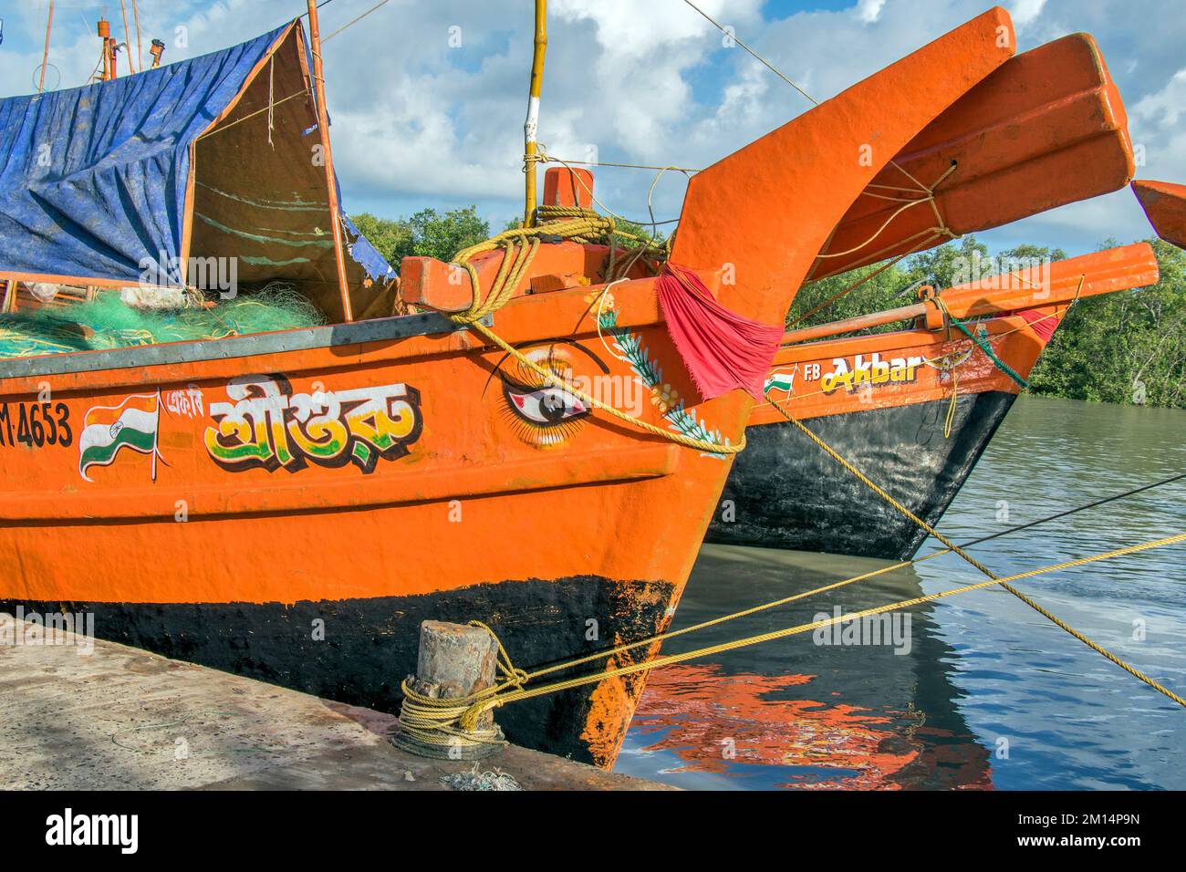 COLOURFUL FISHING BOATS NEAR HARBOUR AREA AT RURAL WEST BENGAL INDIA Stock Photo