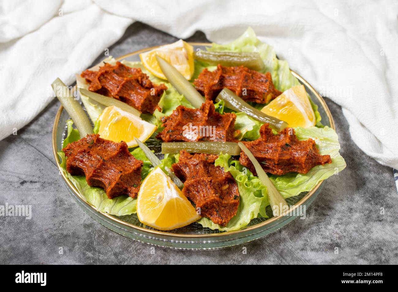 Raw meatballs (cig kofte) on dark background. Turkish cuisine delicacies. close up Stock Photo