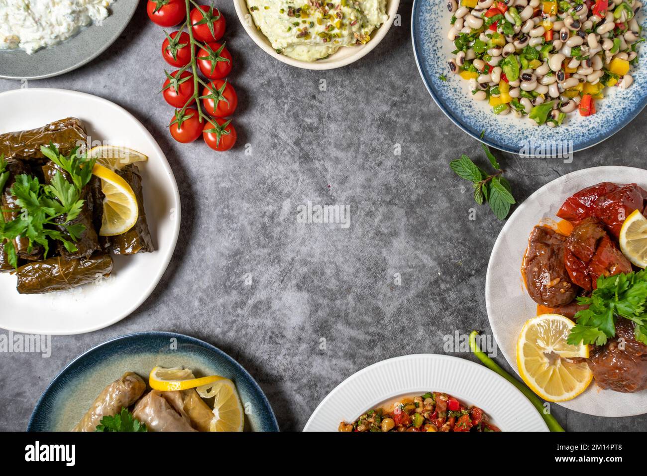 Top view traditional Turkish and Greek dinner appetizer table. Mediterranean appetizer concept. Empty space for text. Raw meatballs, roasted eggplant Stock Photo
