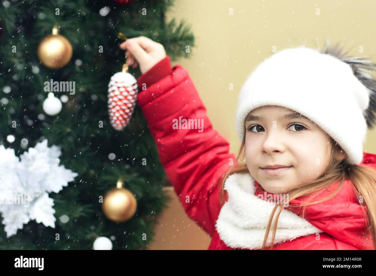 Little Santa stands next to an Armenian wooden Christmas tree toy. There is  a small toy deer near the tree. in miniature. Christmas decorations Stock  Photo - Alamy