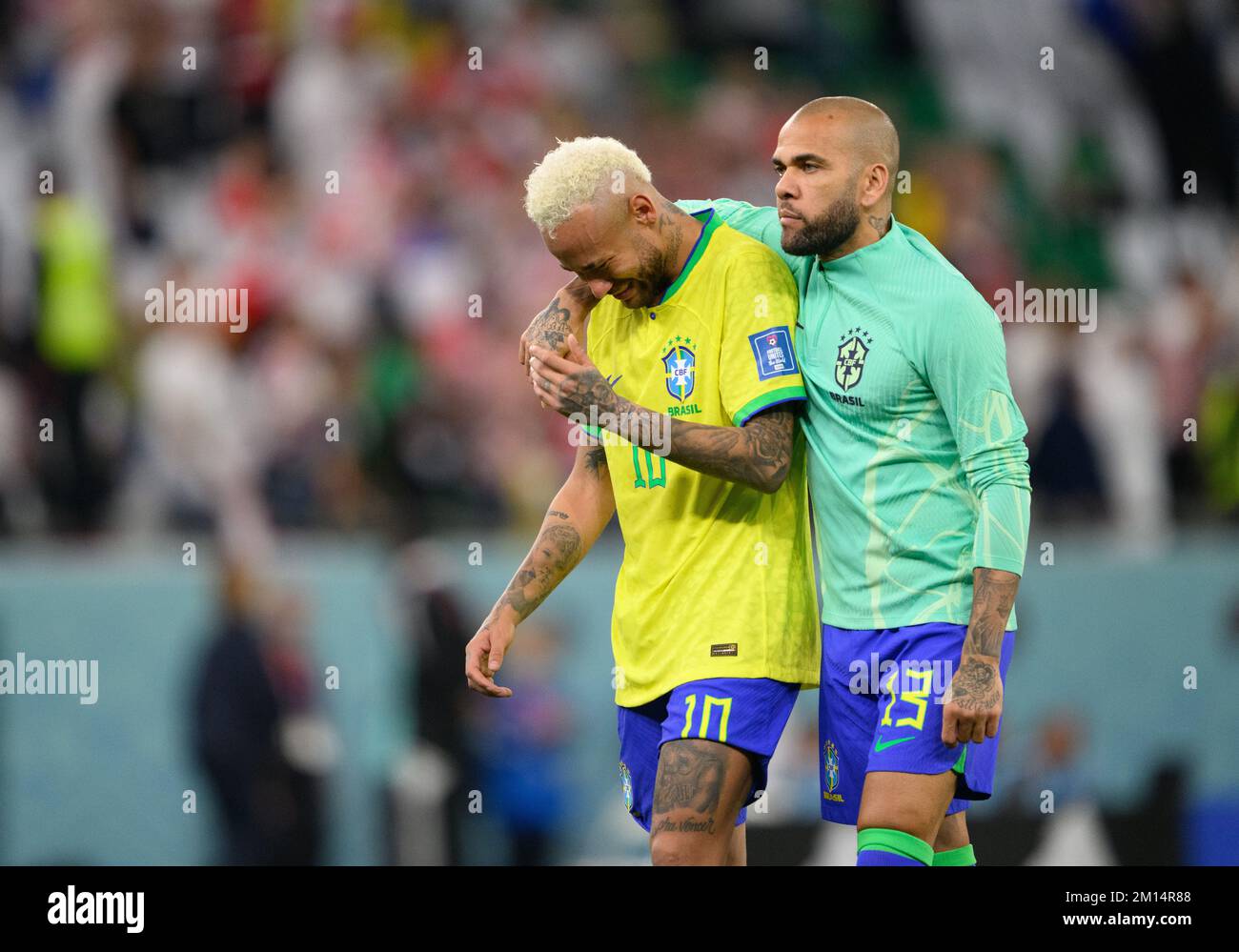 Al Rajjan, Qatar. 09th Dec, 2022. Soccer: World Cup, Croatia - Brazil, final round, quarterfinal, Education City Stadium. Brazil's Dani Alves (r) comforts the crying Brazil's Neymar after the match. Credit: Robert Michael/dpa/Alamy Live News Stock Photo