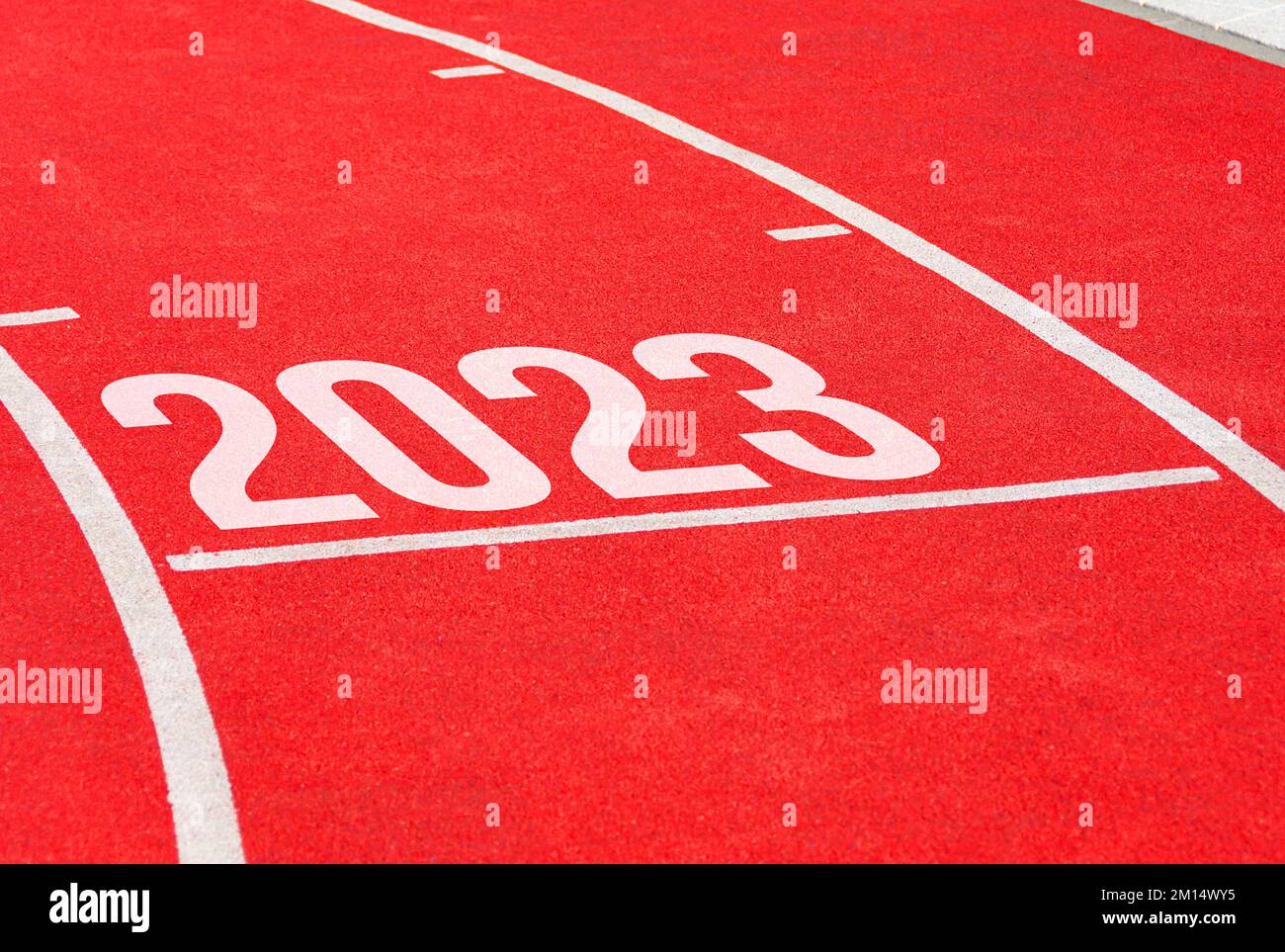 Red running track with new year 2023. Start concept of fresh beginnings, bright future, new life Stock Photo
