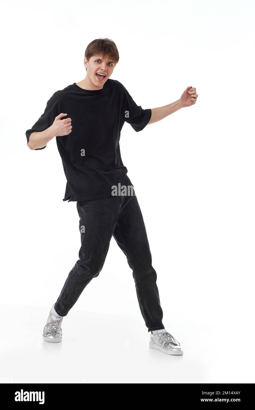 young man in black tshirt and jeans dancing Stock Photo Alamy