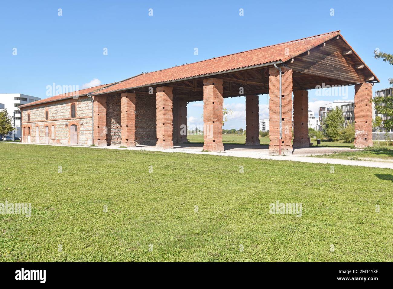 La Grange, Barricou, a restored barn, all that remains of a farm, in what is now the Parc of the ZAC Andromède, in Blagnac, Toulouse, local red brick Stock Photo
