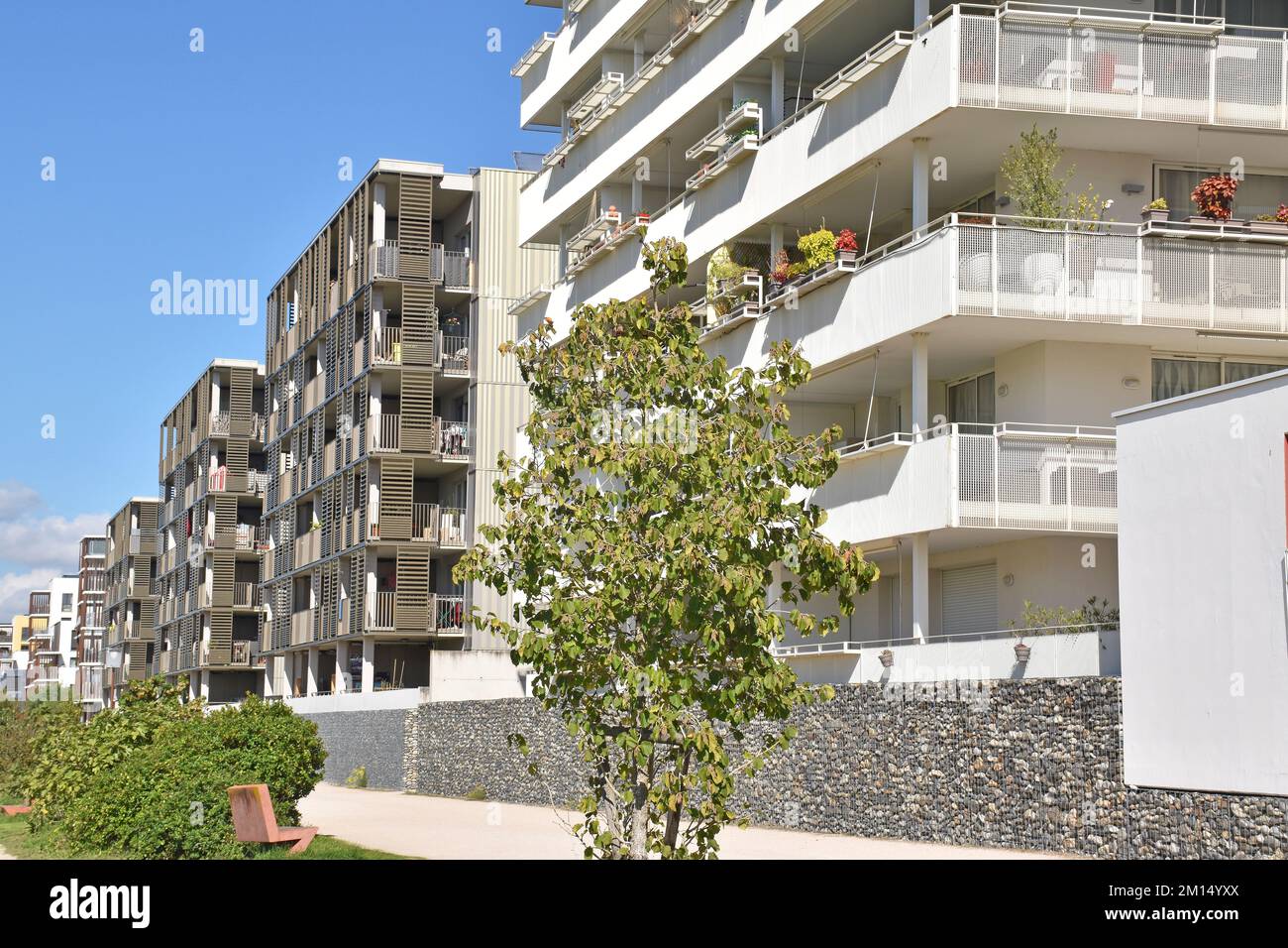 Attractive, airy, balconied six-storey apartment buildings overlooking former farmland, now the Parc of the ZAC Andromède, in Blagnac, Toulouse Stock Photo