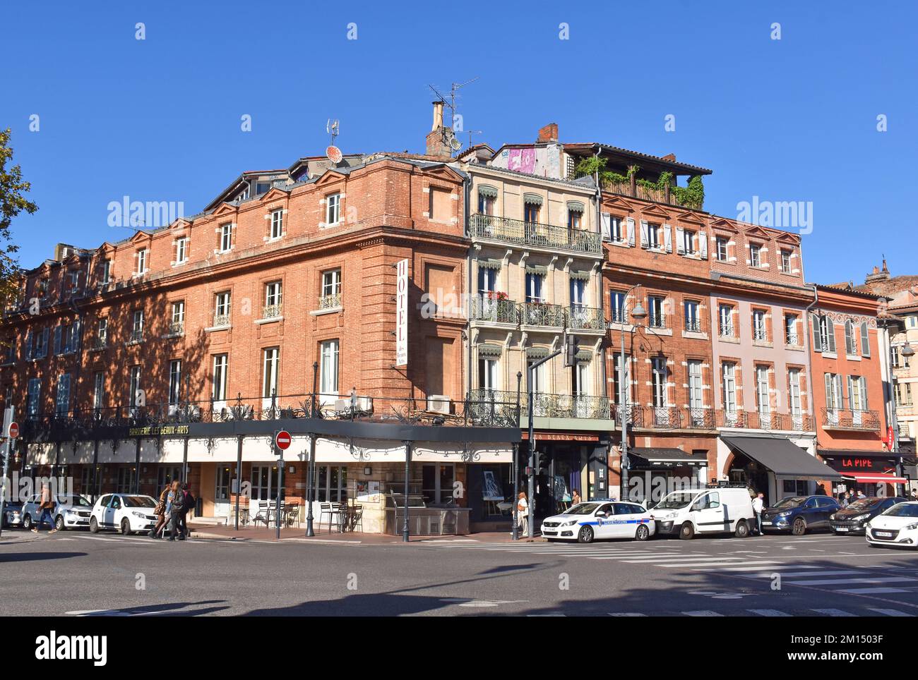 The Hotel des Beaux Arts, a grand C19th building in the red brick and pink sandstone of Toulouse, la ville rouge, classical detailing, boutique hotel Stock Photo