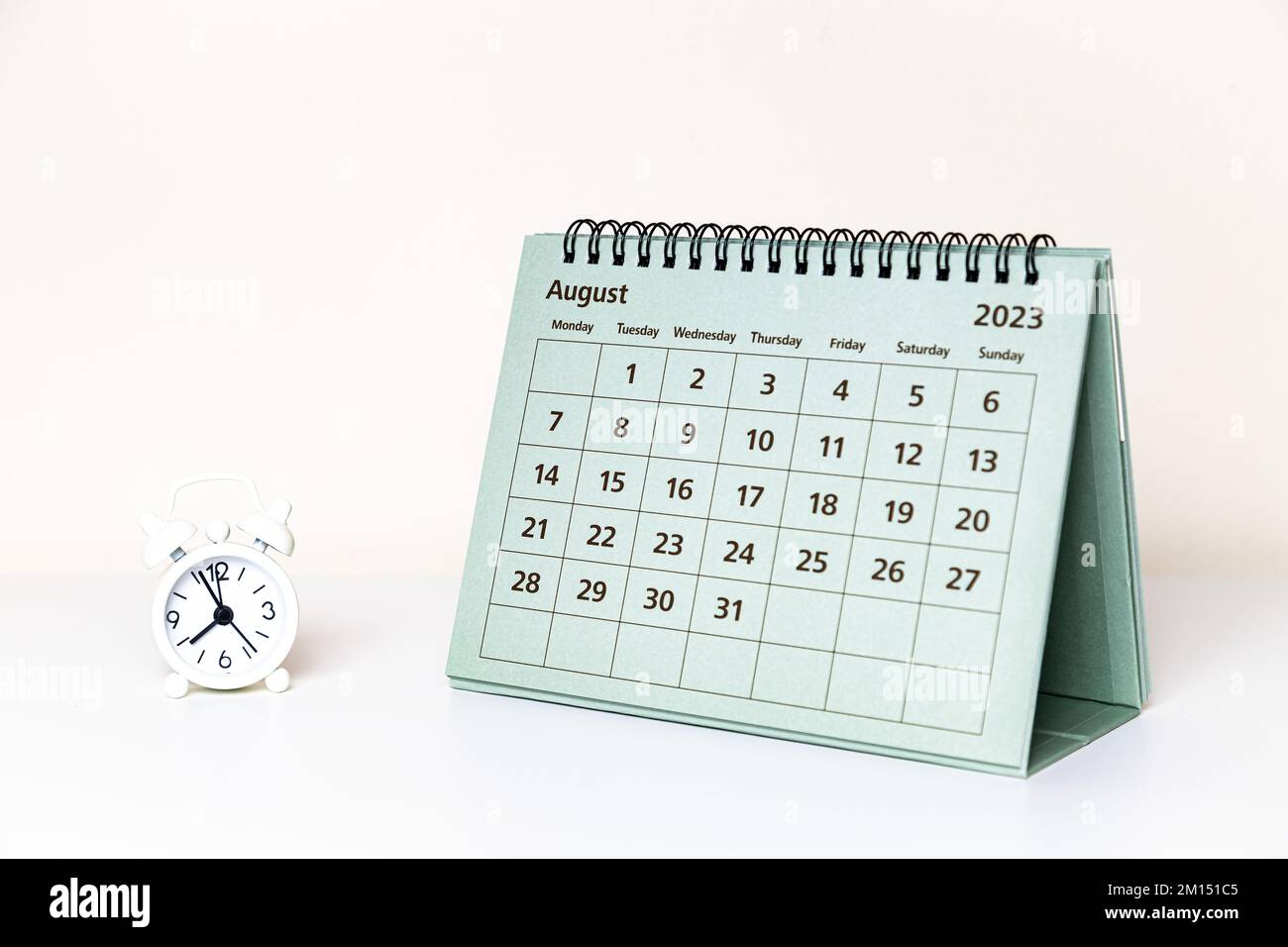 August 2023 calendar and small clock on white background isolated Stock ...