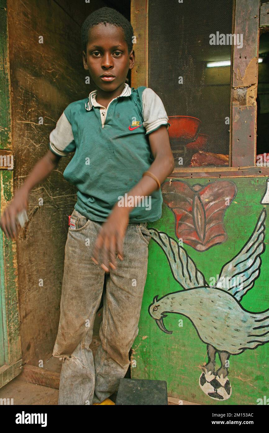Boy standing next to flying eagle grab soccer ball Stock Photo - Alamy