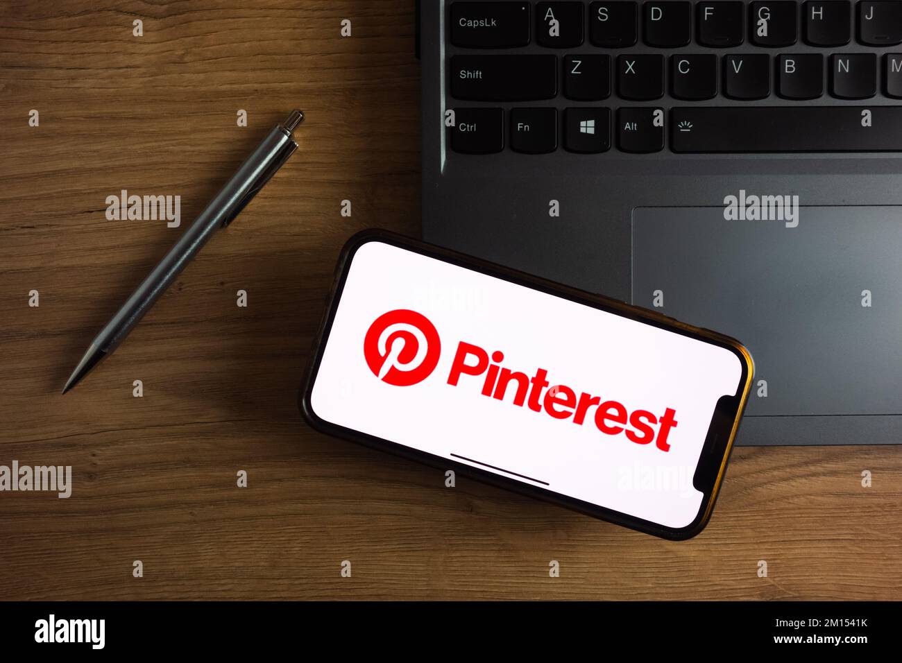 KONSKIE, POLAND - September 17, 2022: Pinterest logo displayed on smartphone screen in the office. Pinterest is an internet photo sharing and publishi Stock Photo