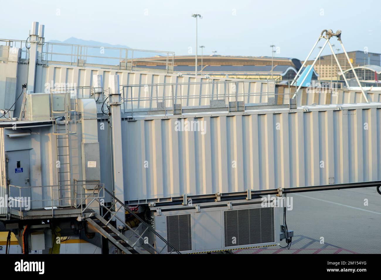 Boarding ramp in Hong Kong airport Stock Photo - Alamy