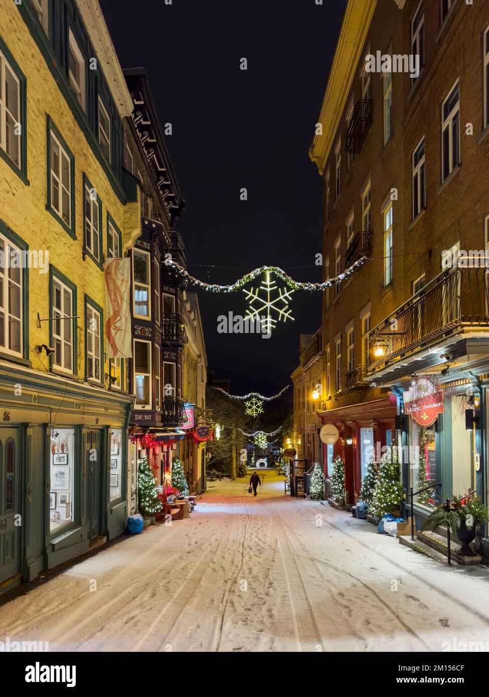 Snow in December in the festive decorated streets of Old Quebec City ...