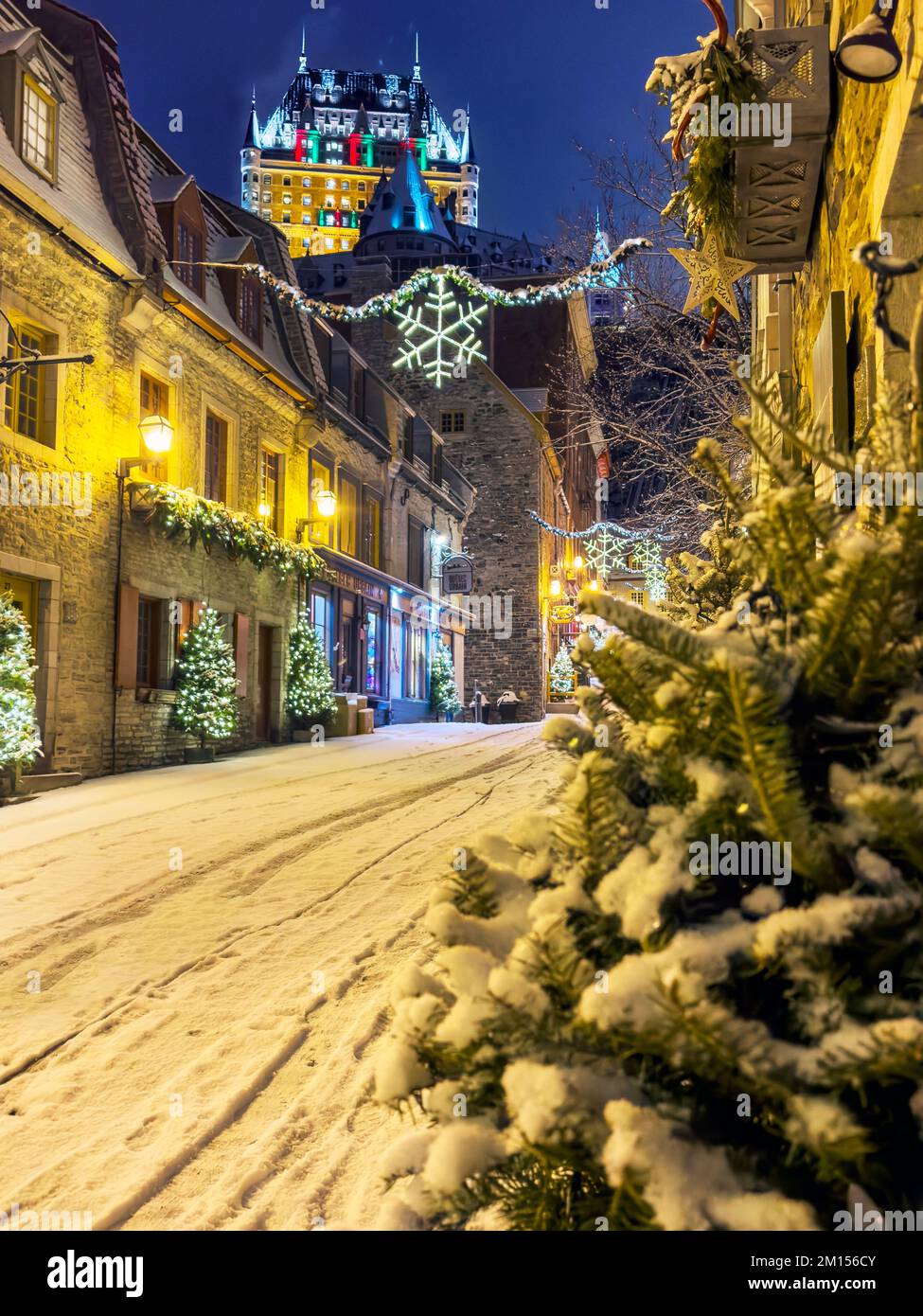 Snow in December in the festive decorated streets of Old Quebec City ...