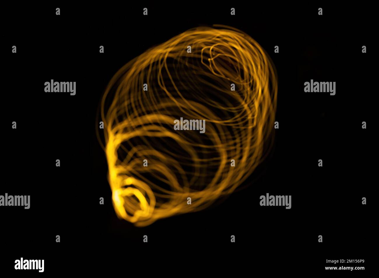 Magic light spirals on black background Stock Photo - Alamy