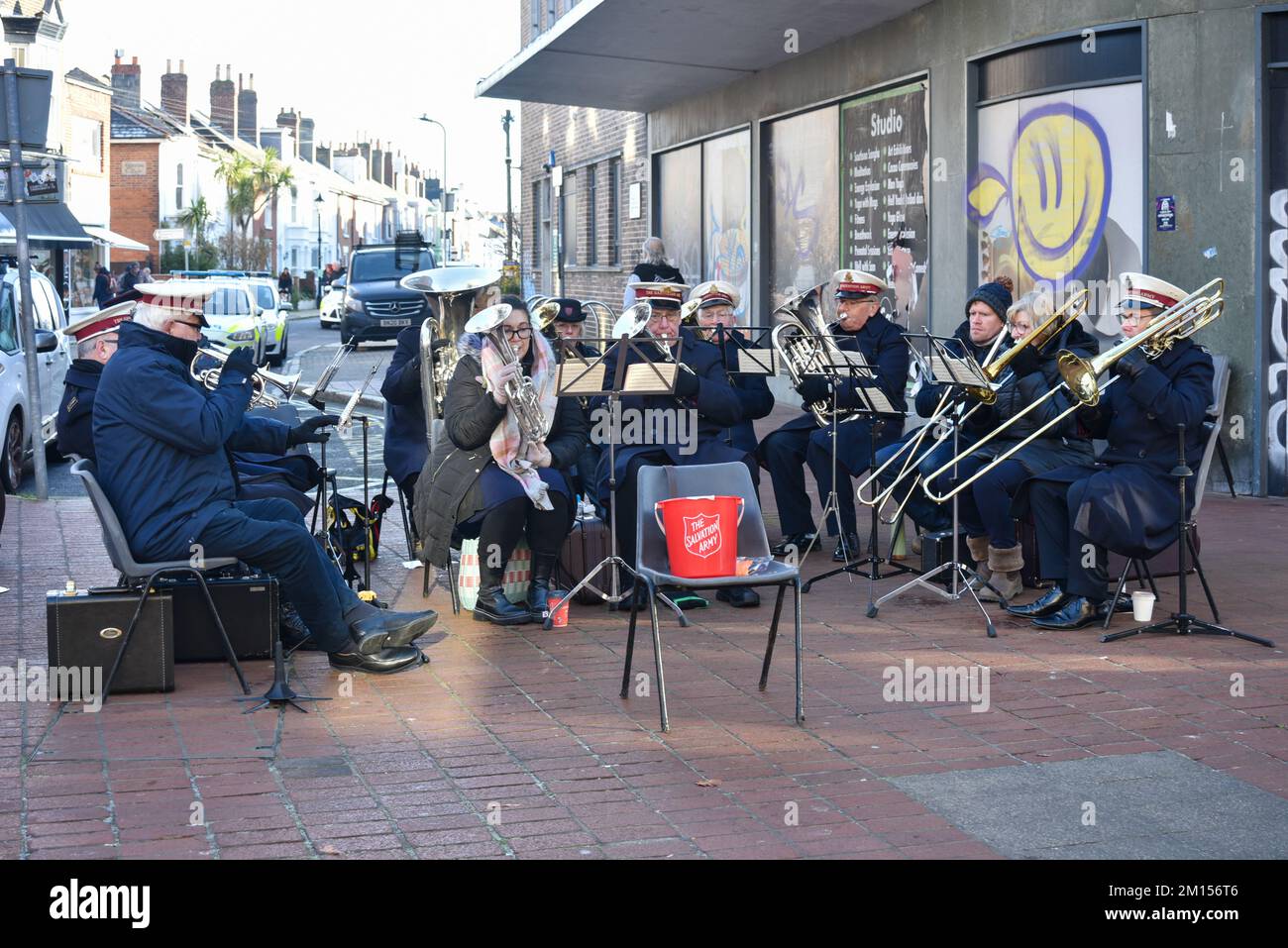 Salvation Army band play music on a street in Portsmouth, England. A common site during the Christmas period. Dec 2022. Stock Photo