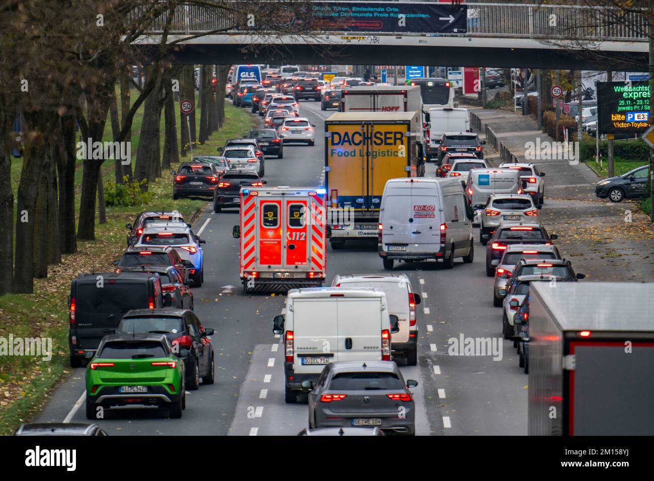 Emergency lane, ambulance making its way through city centre traffic