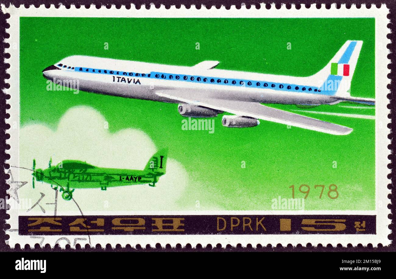 Cancelled postage stamp printed by North Korea, that shows Airplane Douglas DC-8- 63 jetliner and Savoia Marchetti S-71, circa 1978. Stock Photo