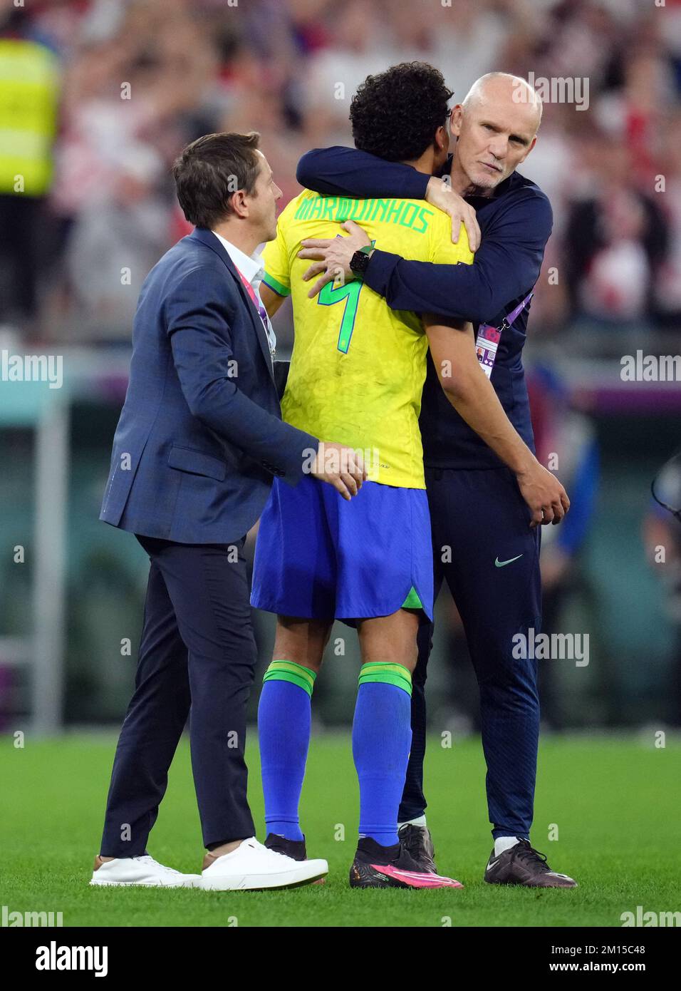 Brazil's Marquinhos is consoled following his penalty miss by Claudio Taffarel and Juninho Paulista following the FIFA World Cup Quarter-Final match at the Education City Stadium in Al Rayyan, Qatar. Picture date: Friday December 9, 2022. Stock Photo