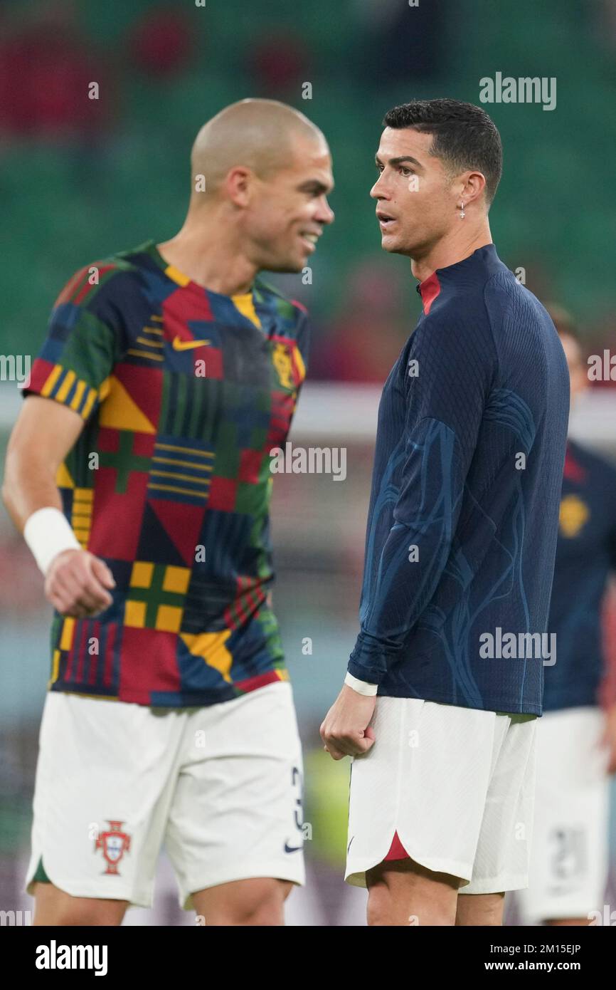 Doha, Qatar. 10th Dec, 2022. Cristiano Ronaldo (R) and Pepe of Portugal warm up before the Quarterfinal between Morocco and Portugal of the 2022 FIFA World Cup at Al Thumama Stadium in Doha, Qatar, Dec. 10, 2022. Credit: Xiao Yijiu/Xinhua/Alamy Live News Stock Photo