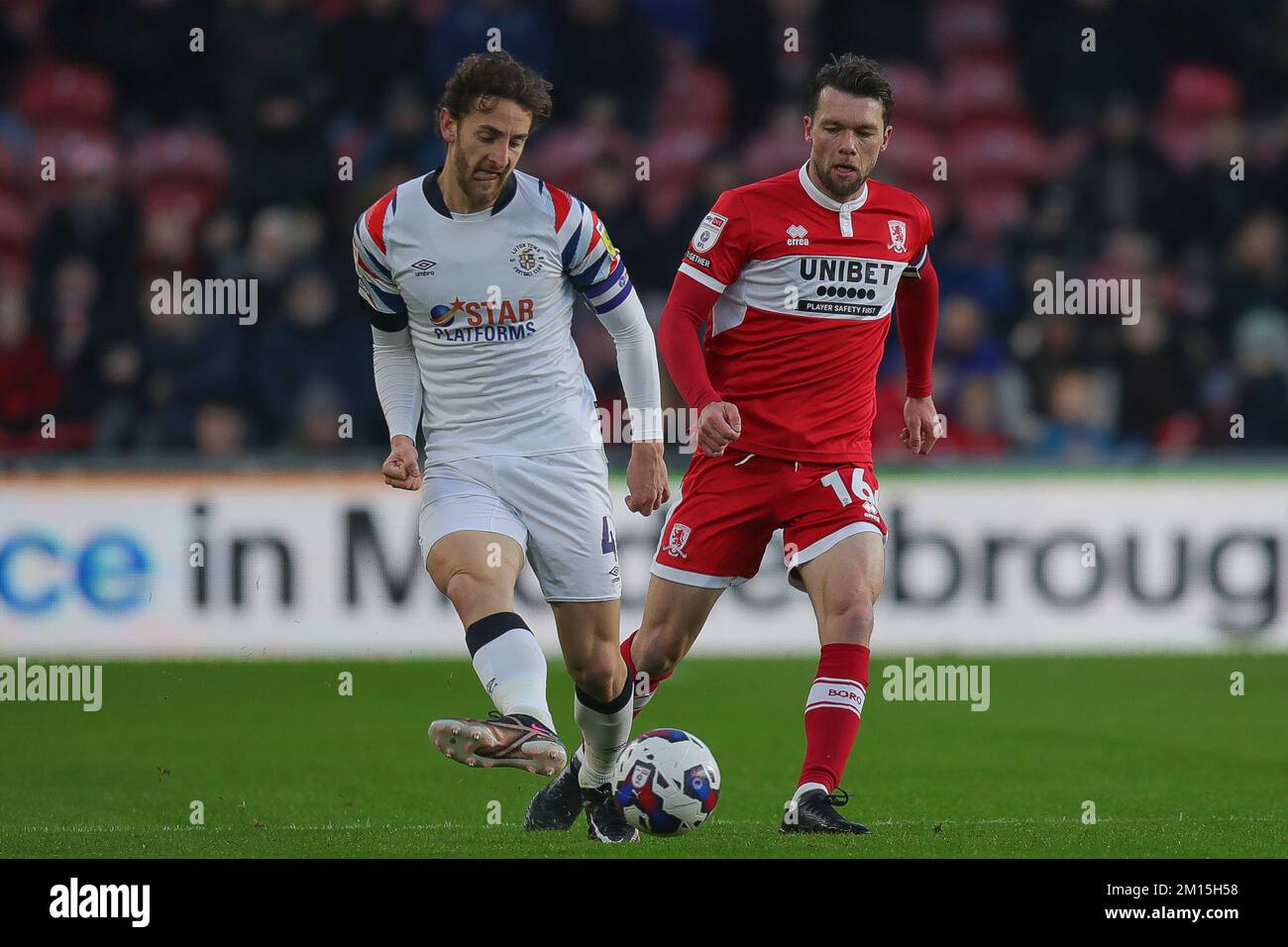 Tom Lockyer #4 of Luton Town and Jonathan Howson #16 of Middlesbrough battle for the ball during the Sky Bet Championship match Middlesbrough vs Luton Town at Riverside Stadium, Middlesbrough, United Kingdom, 10th December 2022  (Photo by James Heaton/News Images) Stock Photo