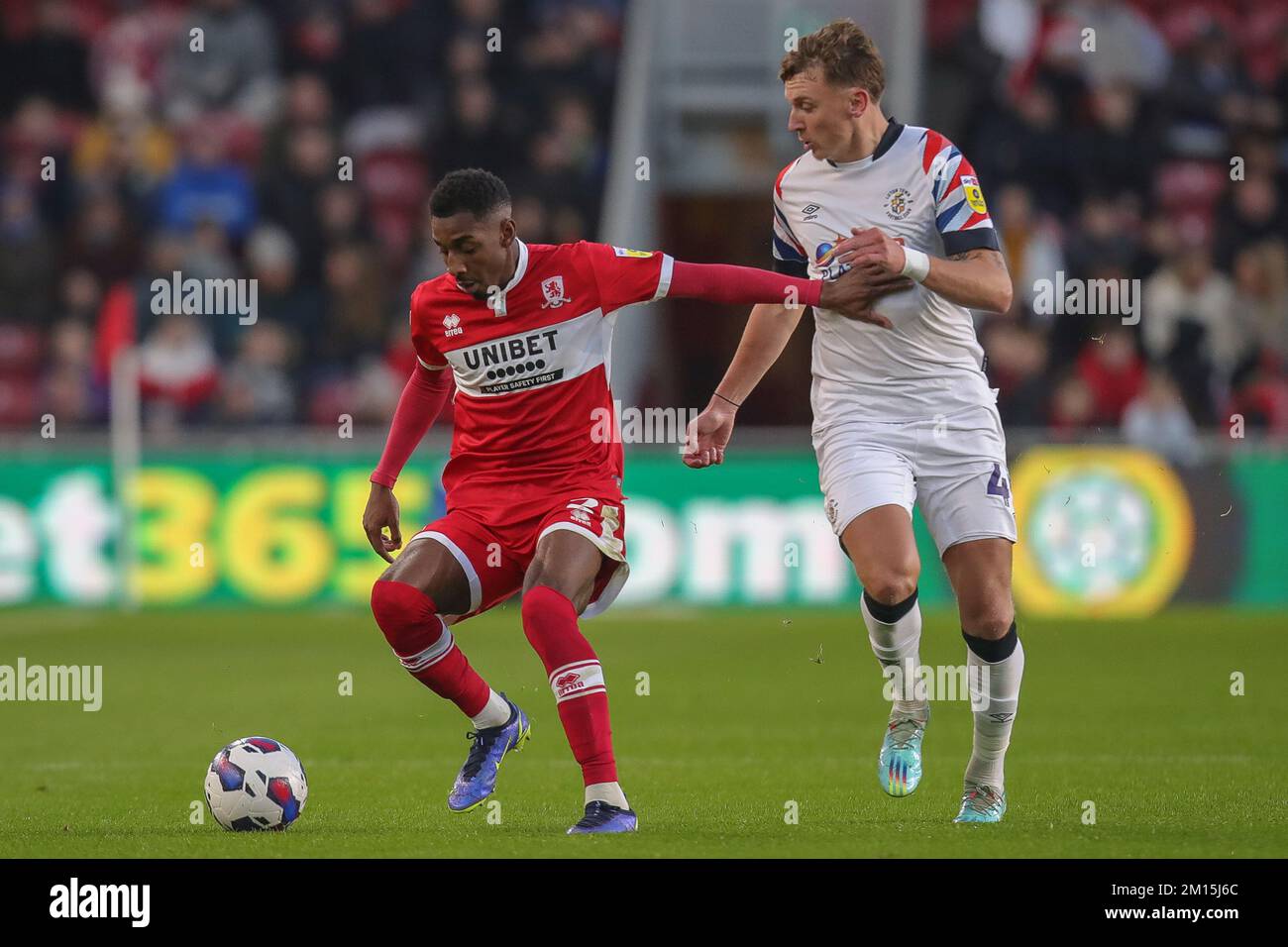 Isaiah Jones #2 of Middlesbrough holds off the challenge of Tom Lockyer #4 of Luton Town during the Sky Bet Championship match Middlesbrough vs Luton Town at Riverside Stadium, Middlesbrough, United Kingdom, 10th December 2022  (Photo by James Heaton/News Images) Stock Photo