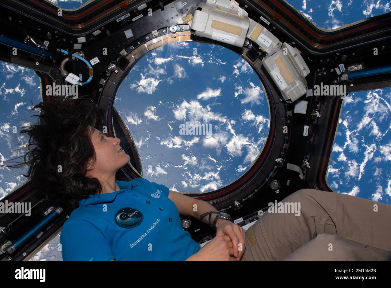 ISS - 01 October 2022 - ESA (European Space Agency) astronaut and Expedition 68 Flight Engineer Samantha Cristoforetti looks at the Earth below throug Stock Photo