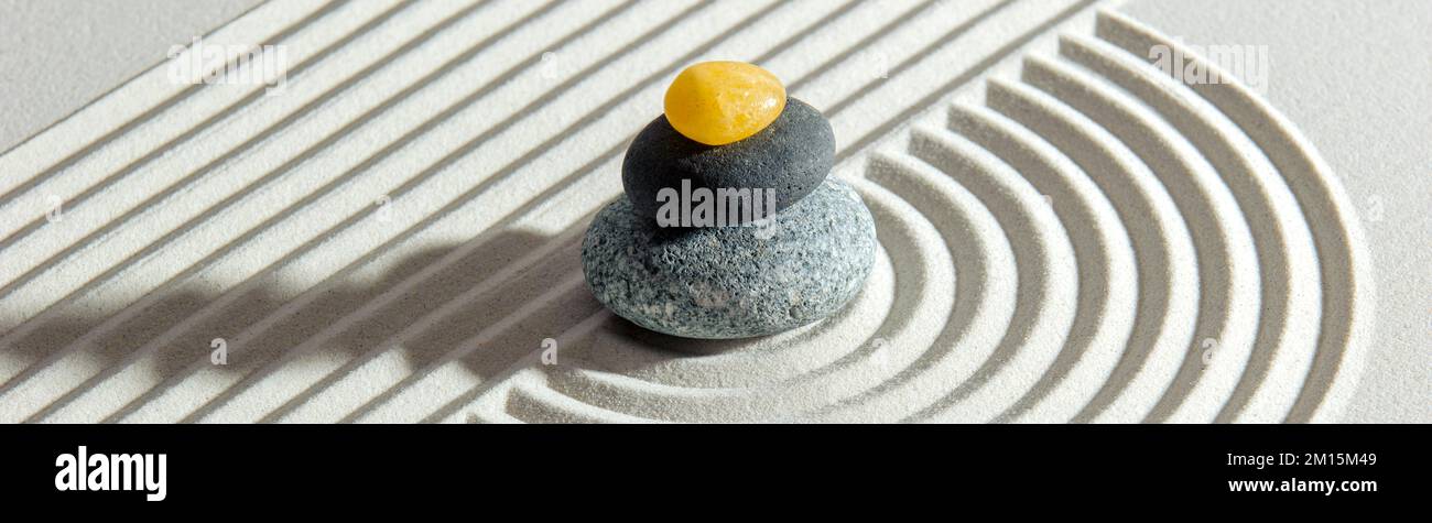 Japanese Zen garden with stone in textured sand Stock Photo