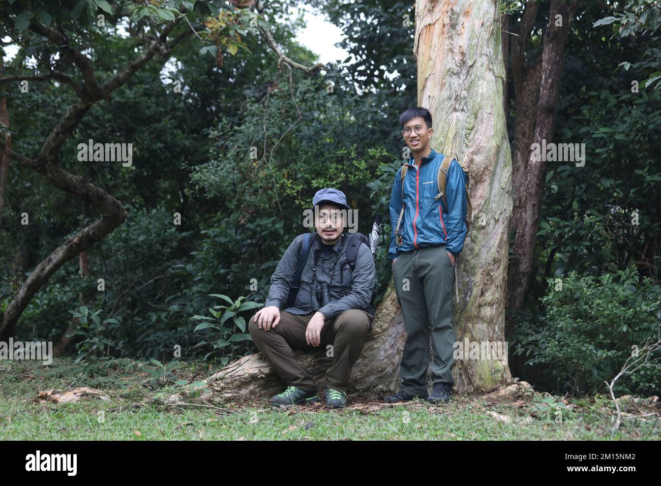 Hikers Matthew Au Yee-chun (left) and Herman Mok Chi-kit in  Shing Mun. The duo bonded over their love for off-trail hiking founded a walking group, Hkhiker, to venture into the city's covert corners. 26NOV22 SCMP / Xiaomei Chen Stock Photo