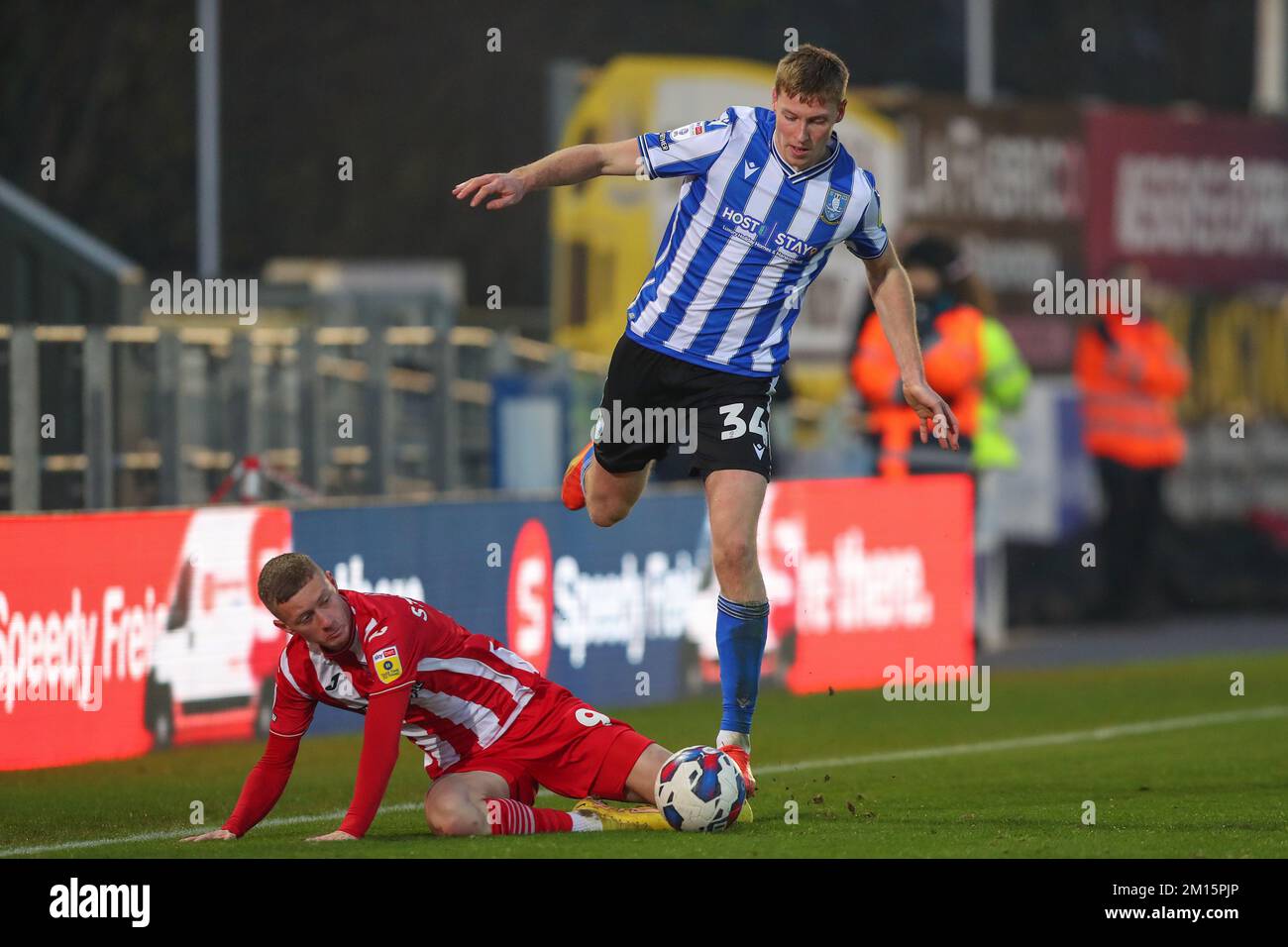 Mark McGuinness #34 of Sheffield Wednesday and Jay Stansfield #9 of Exeter City battle for the ball during the Sky Bet League 1 match Exeter City vs Sheffield Wednesday at St James' Park, Exeter, United Kingdom, 10th December 2022  (Photo by Gareth Evans/News Images) Stock Photo