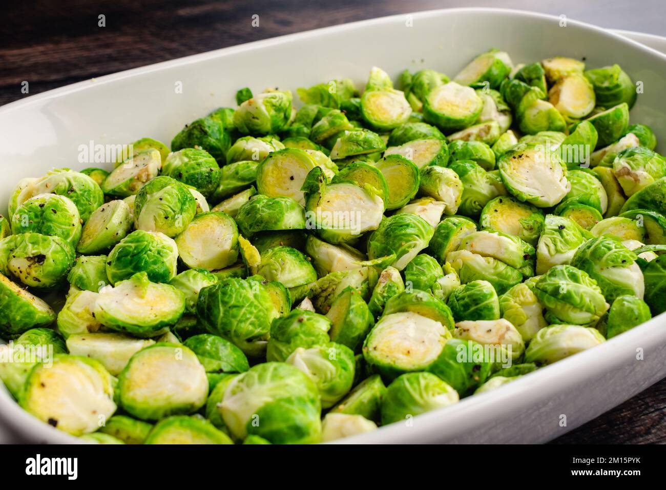 Low Angle View of Halved Brussels Sprouts Tossed in Extra Virgin Olive