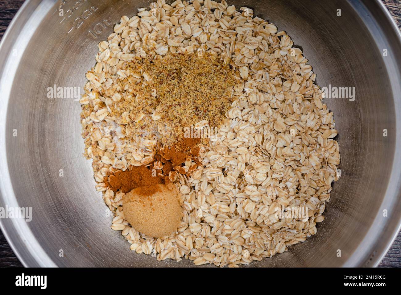 Dry Ingredients for Baked Oatmeal in a Mixing Bowl Closeup Rolled oats