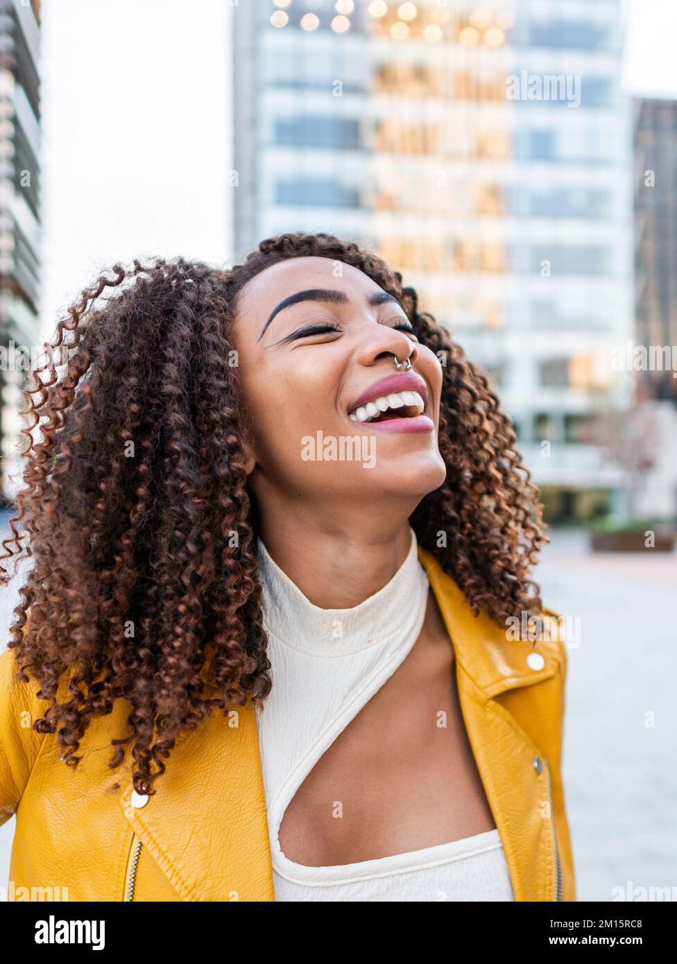 Cheerful millennial black curly hi-res stock photography and images - Alamy