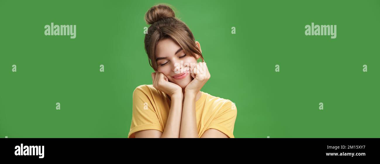 Tender sensual timid european girl in yellow t-shirt leaning head on ...